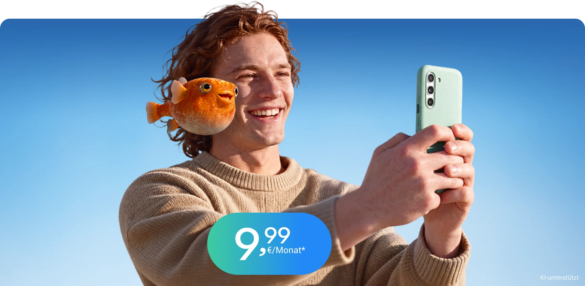 Junger Mann und fliegender Fisch schauen auf einem Handy