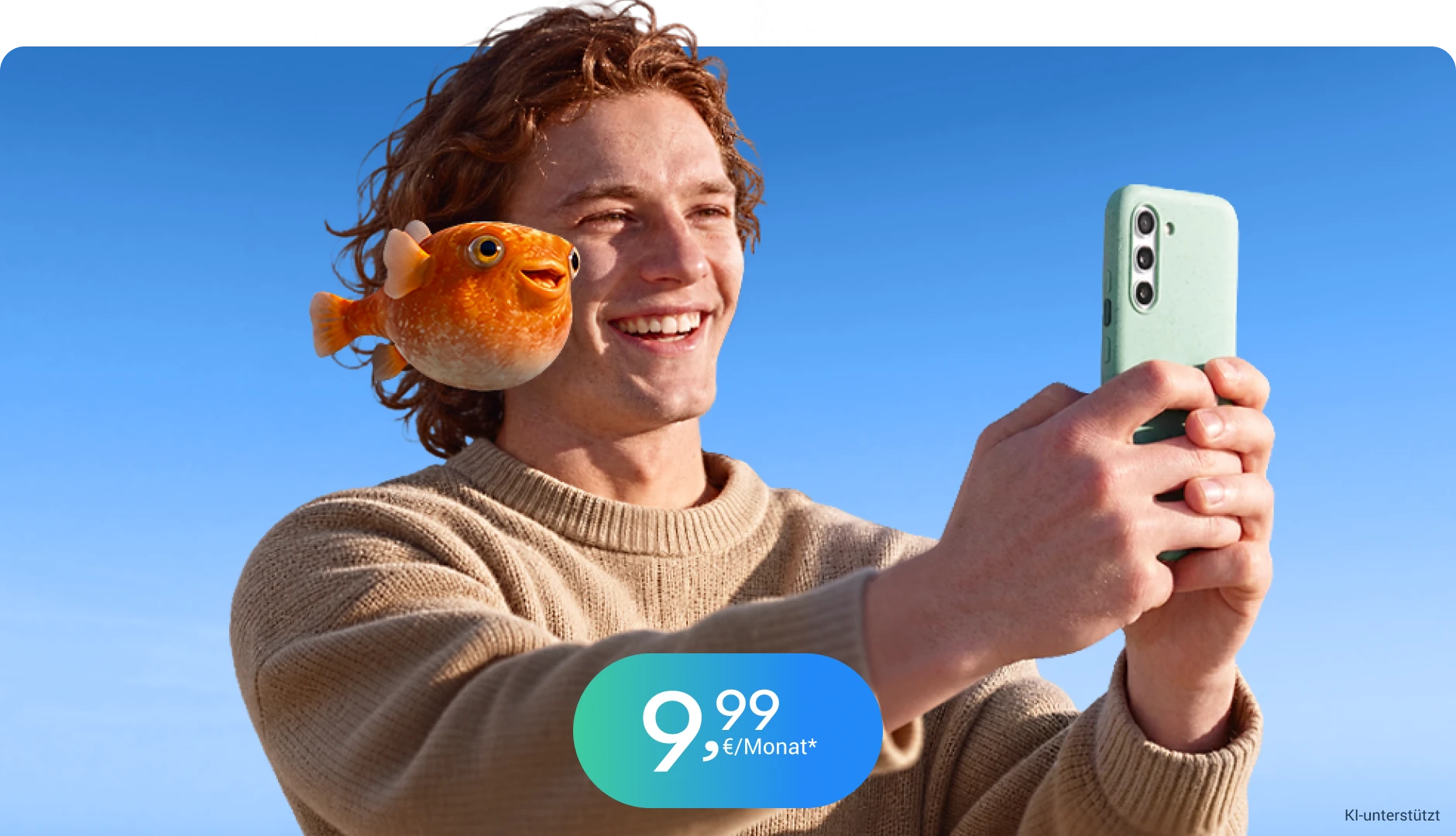 Junger Mann und fliegender Fisch schauen auf einem Handy