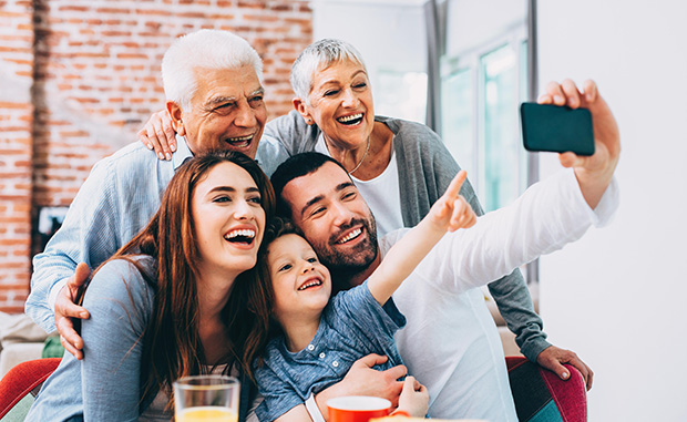 Three generations of family take selfie together