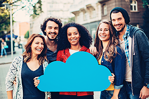 Smiling group of people holding a blue cloud symbol