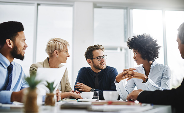 Four professionals in a business meeting