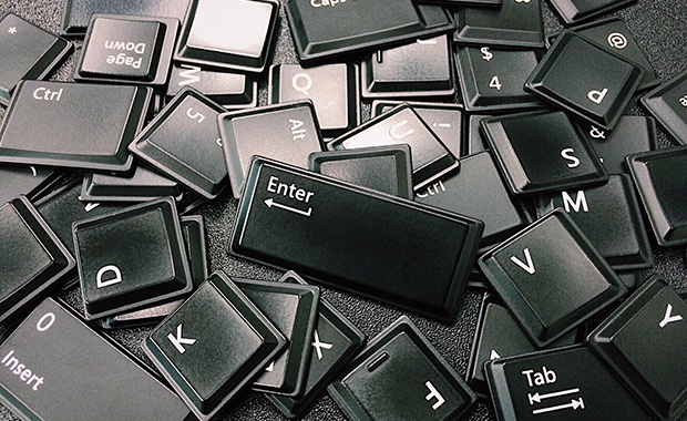 Loose pile of black computer keyboard keys