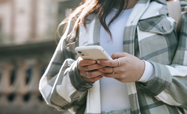 Woman’s hand holding smartphone