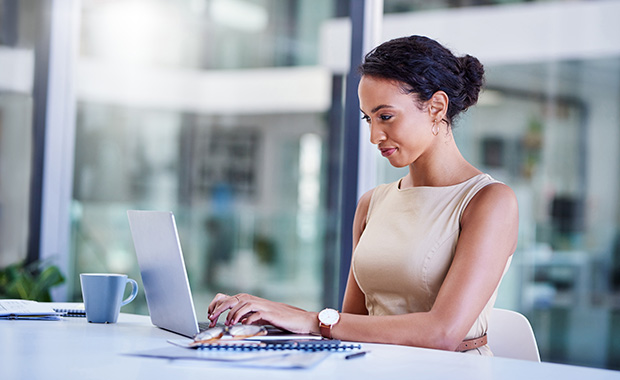 Smiling businesswoman working at computer