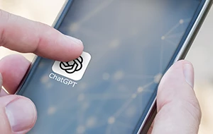 A person is about to tap the ChatGPT app icon on a smartphone screen.