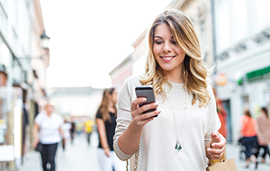 Woman Finding shopping deals on smartphone