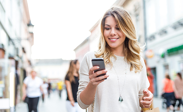 Woman Finding shopping deals on smartphone