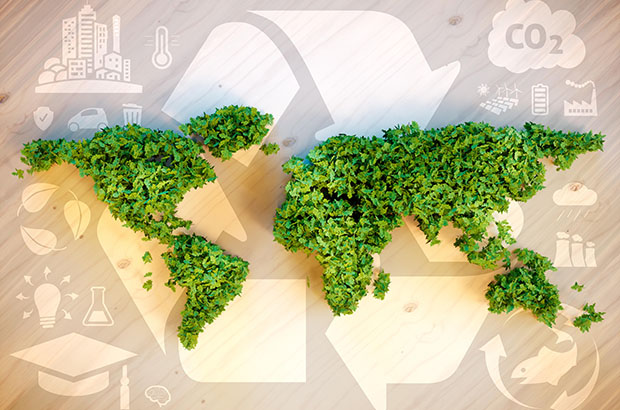 Map of world made of green plants on beige background with recycling symbols