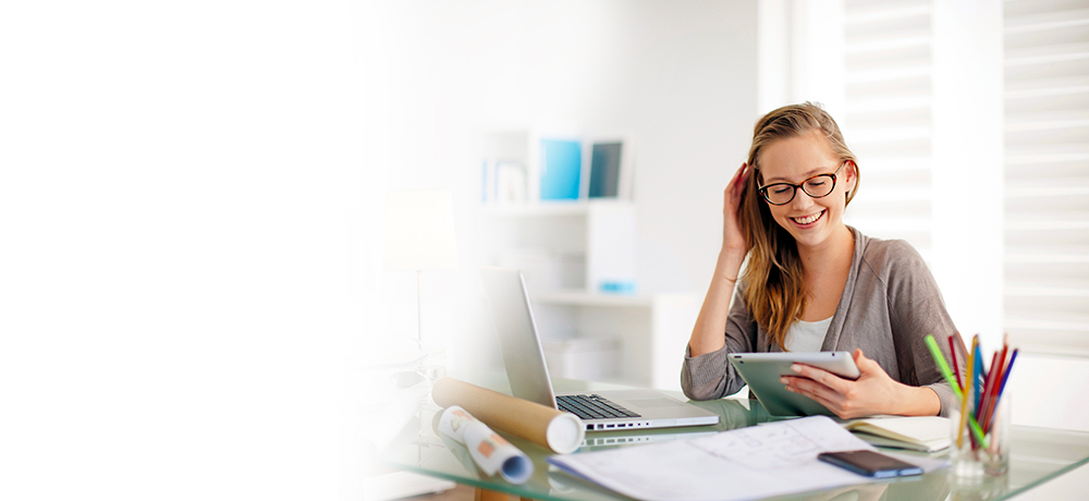 smiling woman checking all her email accounts in one place