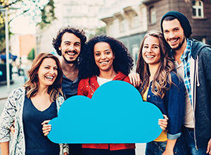 Smiling group of people holding a blue cloud symbol