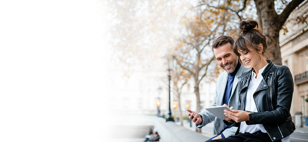 woman and man with smartphone and tablet