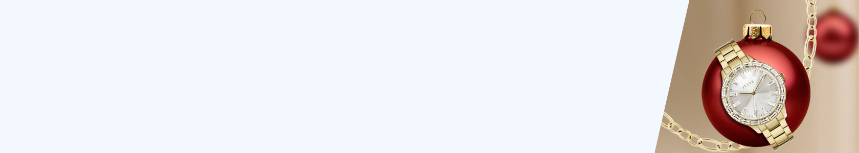 Rote Weihnachtskugel mit goldener Uhr darum gebunden.