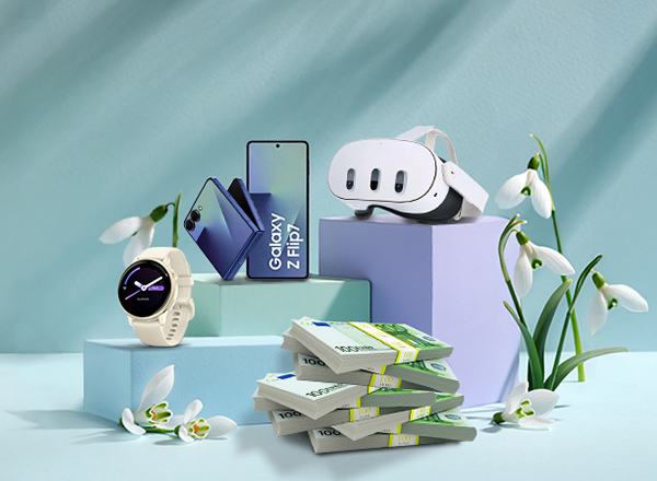 Smartphone, Smartwatch und VR-Brille auf Podesten, daneben gestapelte Geldscheine.